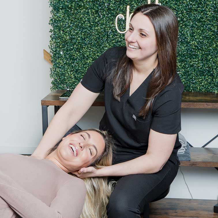 Dr. Abby Dante treating a patient's neck
